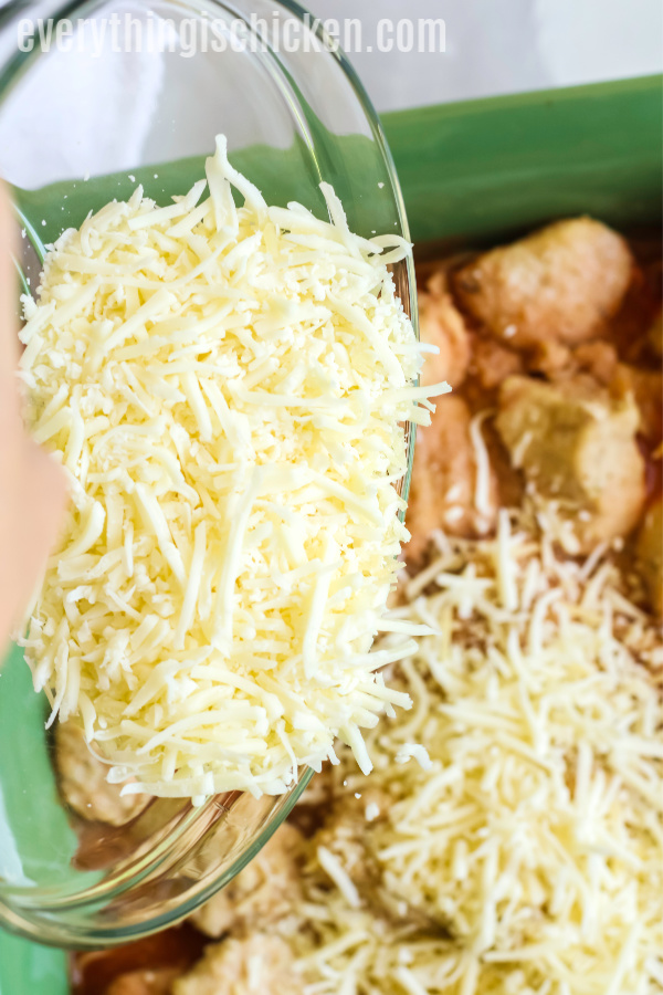 Cheese added to the chicken parmesan casserole. 