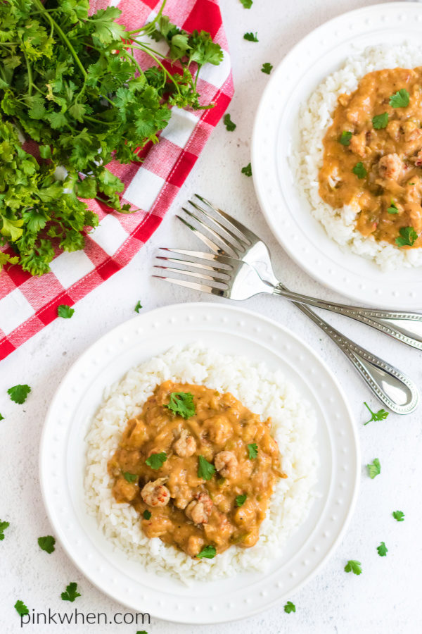 Crawfish Etouffee scooped and served over a bed of rice. 