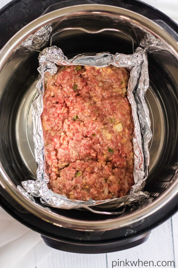 Meatloaf wrapped in foil and placed into the Instant Pot.