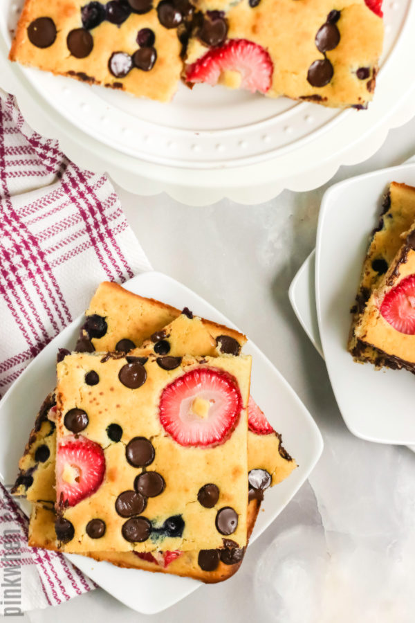 Pancakes with strawberries and chocolate chips cut into squares and ready to serve.