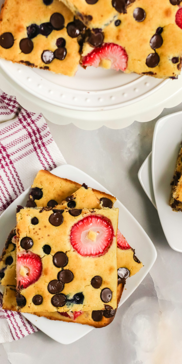 Sheet Pan pancakes are easy and simple to make! Made with flour, vanilla, your favorite fruits and additions, butter, milk, sugar, and more. You won't believe how quickly these come together and how delicious they are to eat! No flipping required.