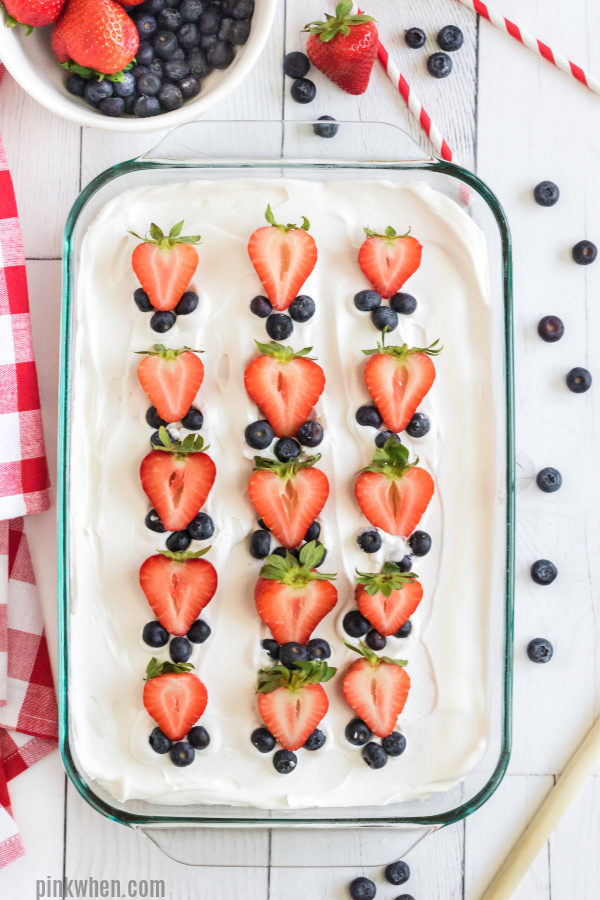 Strawberry Poke Cake ready to cut and serve. 