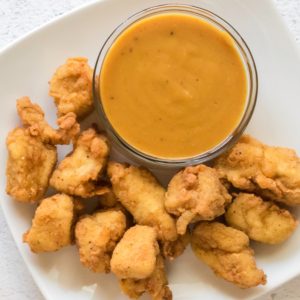 Chick Fil A Sauce and nuggets on a white plate