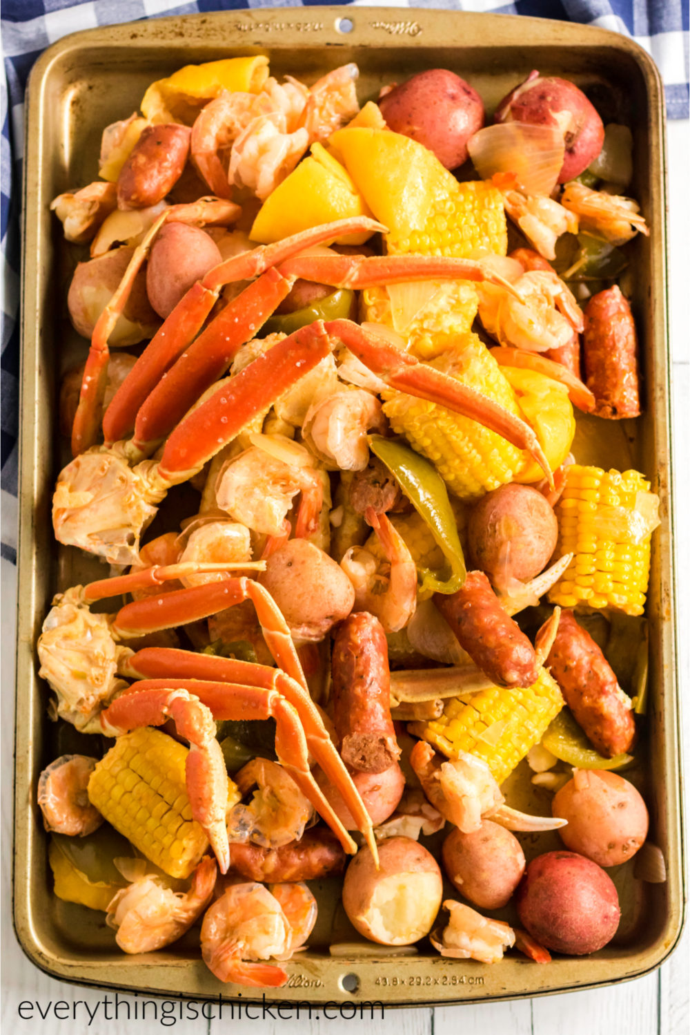 Fully seafood boil finished and served on a baking sheet and ready to eat.