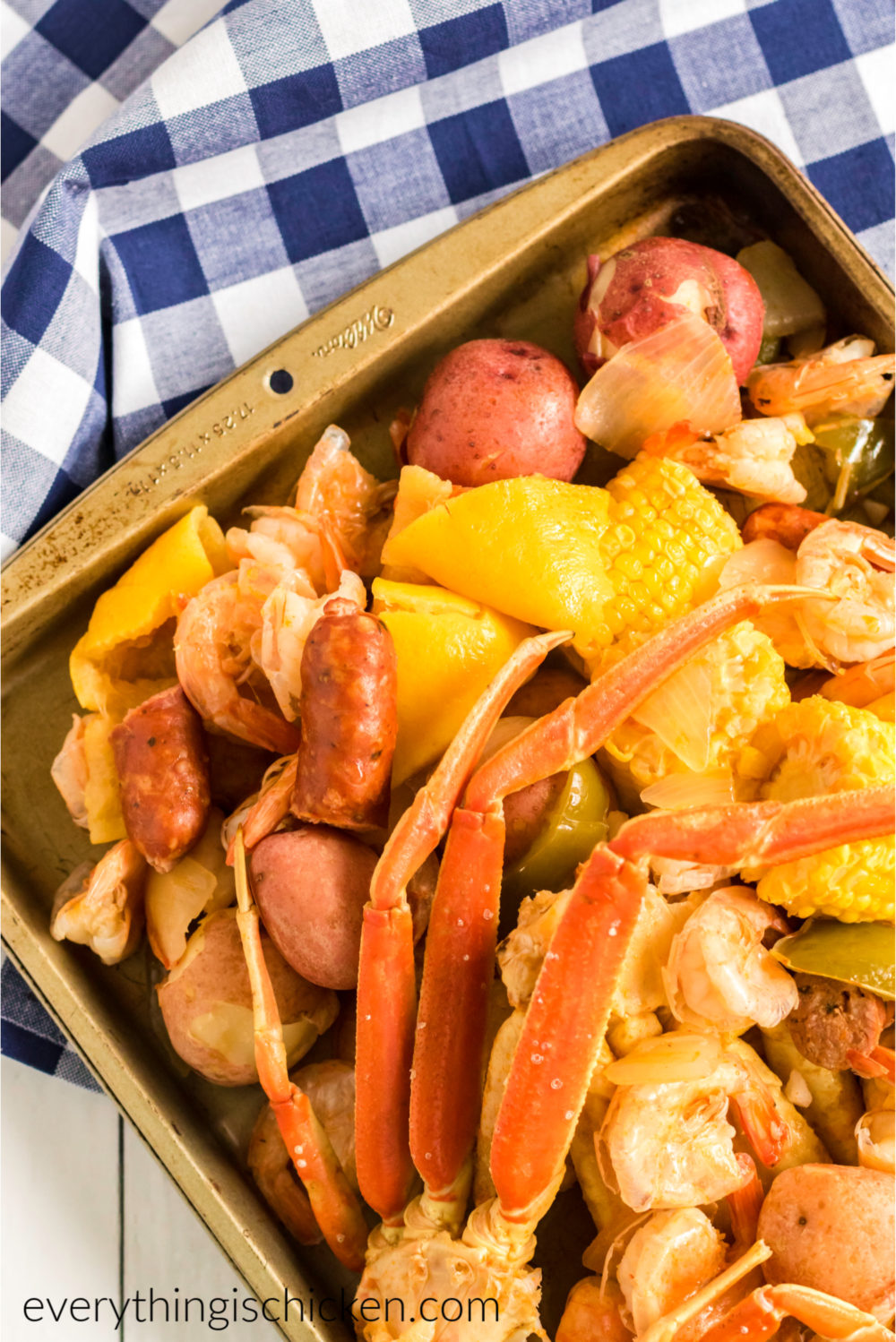 Cajun seafood boil on a checkered napkin and ready to serve.