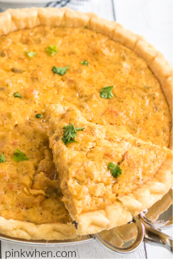 A slice of crawfish pie being removed from the dish. 