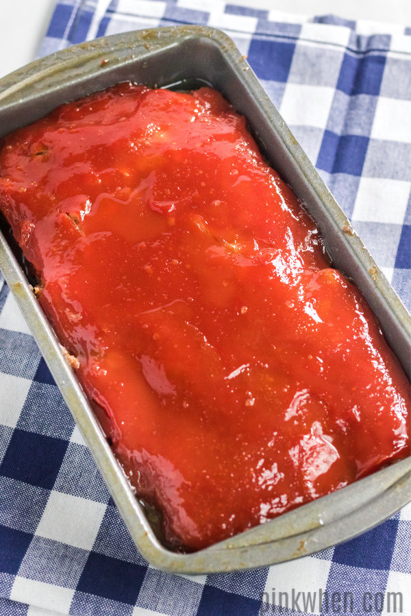 Freshly baked meatloaf cooling before being sliced for serving. 