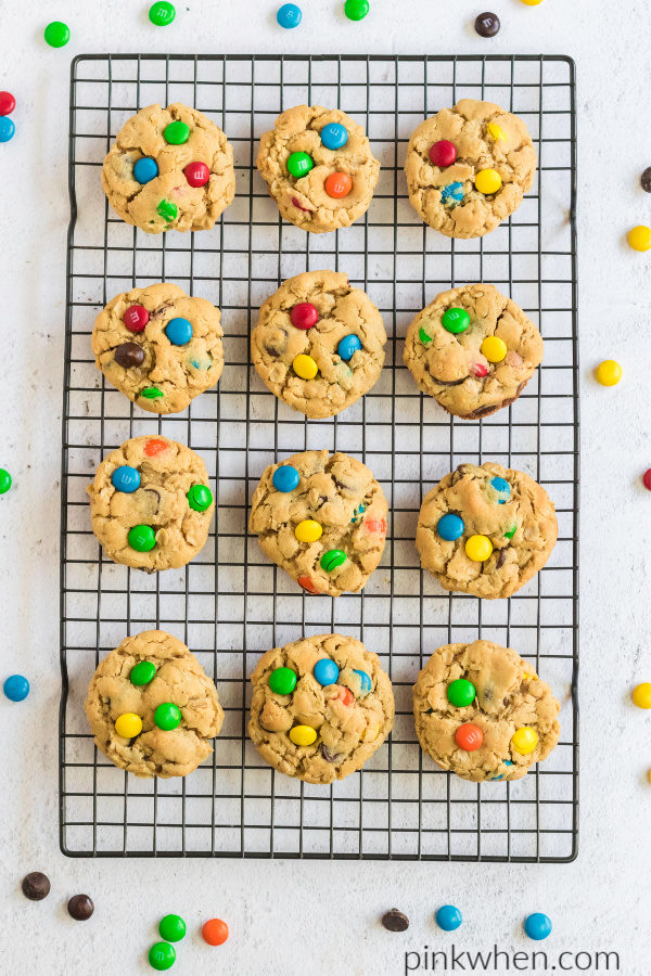 Monster cookies on a cooling rack, ready to eat. 