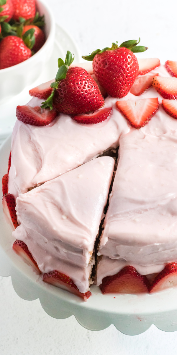 This delicious Strawberry Cake is made with fresh strawberries, strawberry reduction, homemade strawberry cream cheese frosting, and more. It's actually a lot simpler than it sounds! It's the perfect summertime strawberry dessert that will wow your friends and family alike.