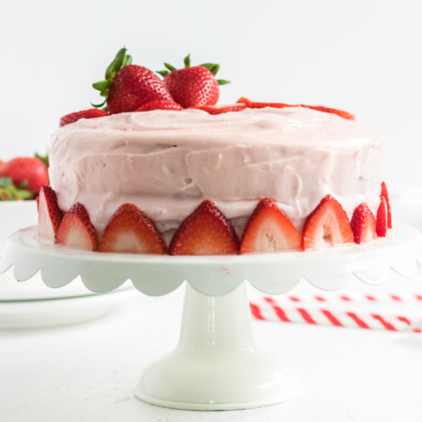 Strawberry Cake with Cream Cheese Frosting on a cake plate