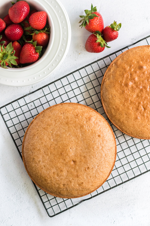 Strawberry Cake on a cooling rack.