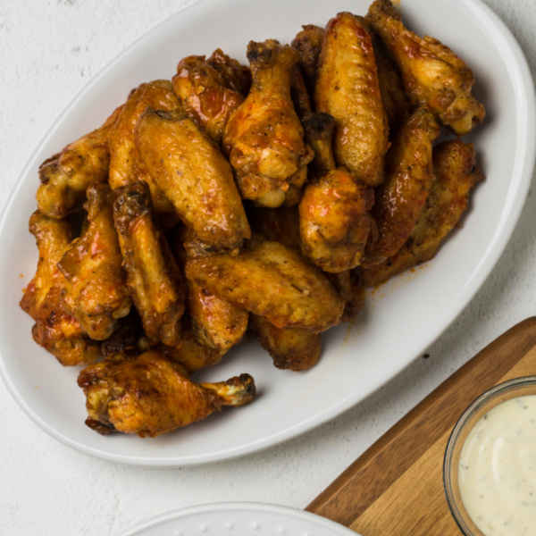 Air Fryer Chicken Wings on a white dish.