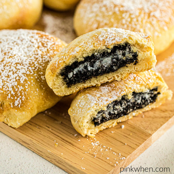 Air Fryer OREOs cut in half and sprinkled with powdered sugar.