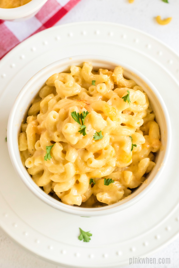 Baked Macaroni and Cheese in a bowl on a plate. 