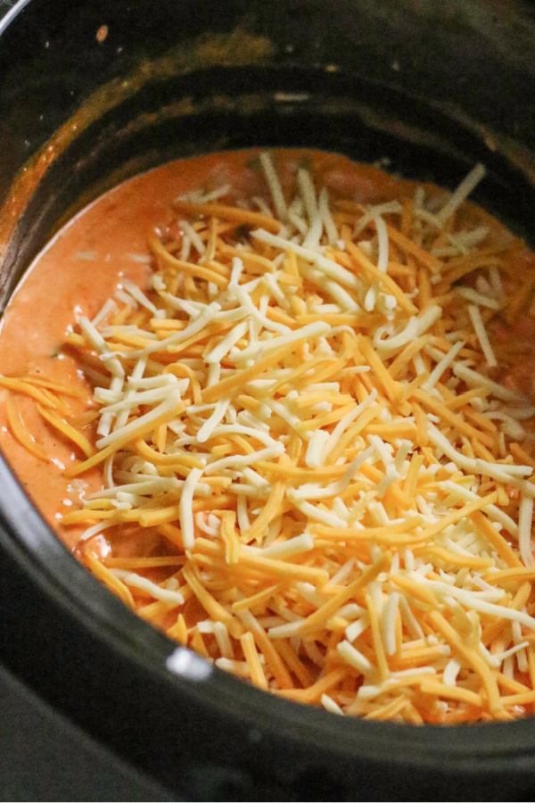 buffalo chicken dip in the crock pot and covered with cheese.