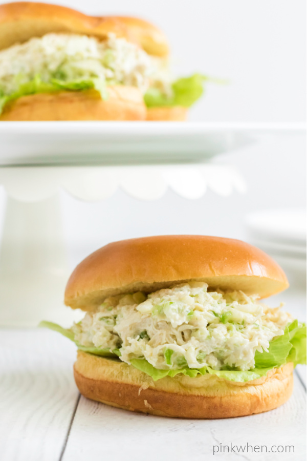 Chicken salad on a bun and ready to eat.