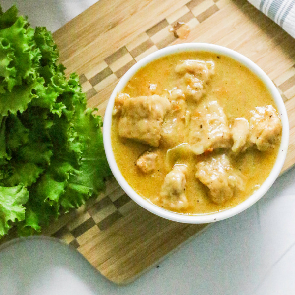 chicken and dumplings in a bowl ready to serve.