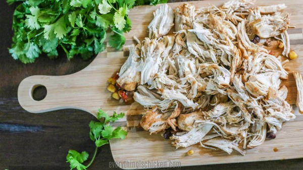 shredded chicken on a cutting board