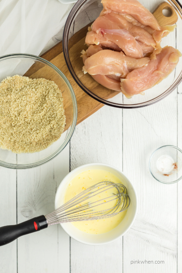 Milk and eggs whisked together for chicken strips.