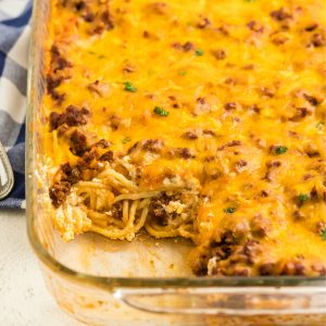 Baked spaghetti missing a slice.