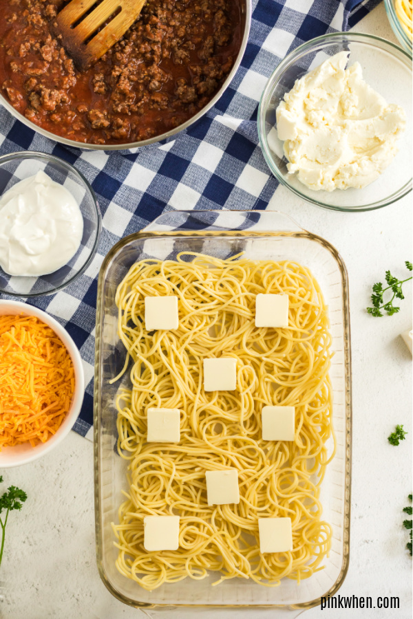 Baked spaghetti layers with butter on top. 