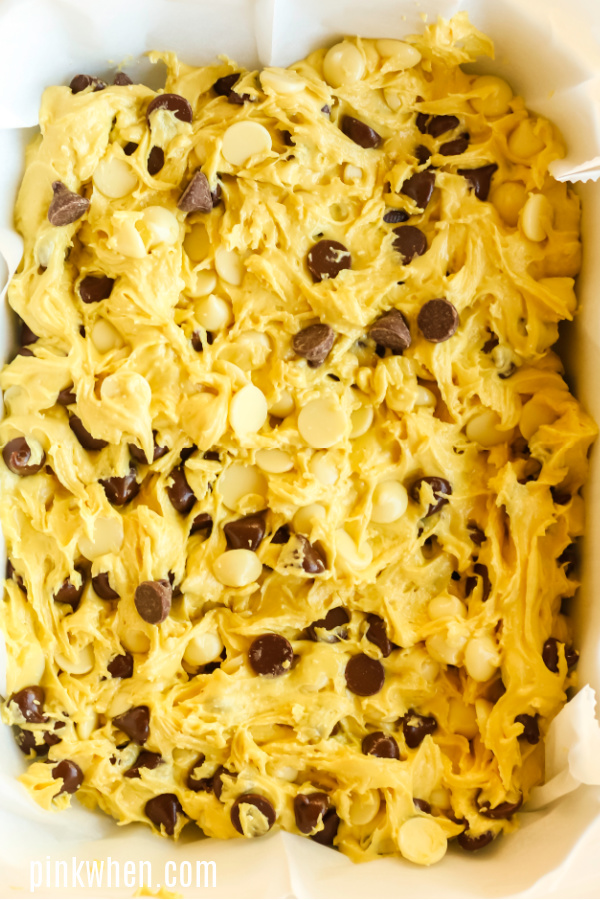 Dough mixture spread out over parchment paper and ready to bake.