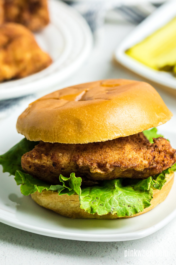 Copycat Chick Fil A sandwich on a white plate ready to serve.