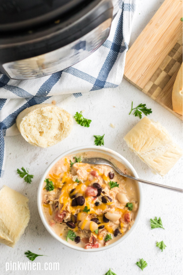 Chicken chili from the pressure cooker in a white bowl. 