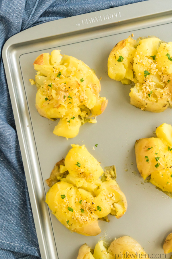 Garlic smashed potatoes on a cookie sheet and ready to eat. 