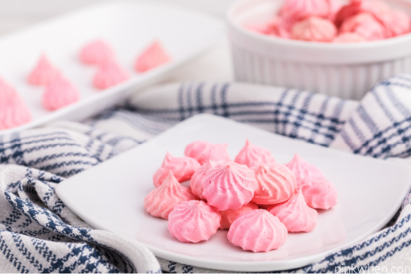 Meringue cookies on a white plate ready to eat.