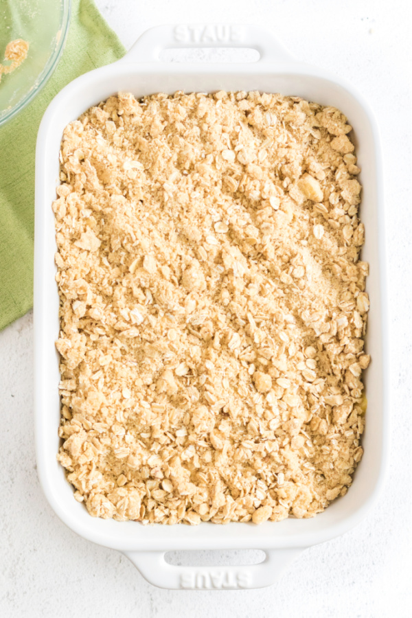 Cirsp covered in an oatmeal crumble in a 9 x 13 baking dish.