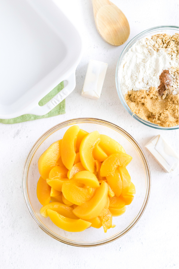 Ingredients needed to make a peach crisp. 