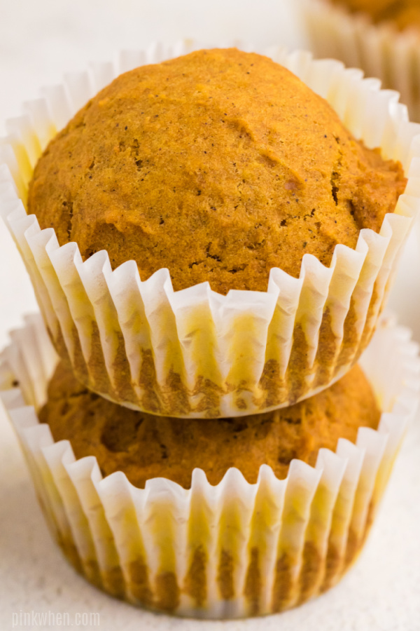 Pumpkin muffins stacked.