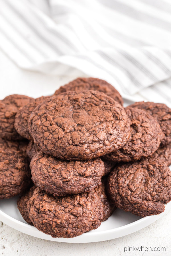 Brownie mix cookies arranged around a white plate.