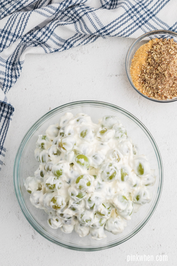 Grape salad with cream cheese mixture blended and awaiting the pecan and graham cracker topping. 