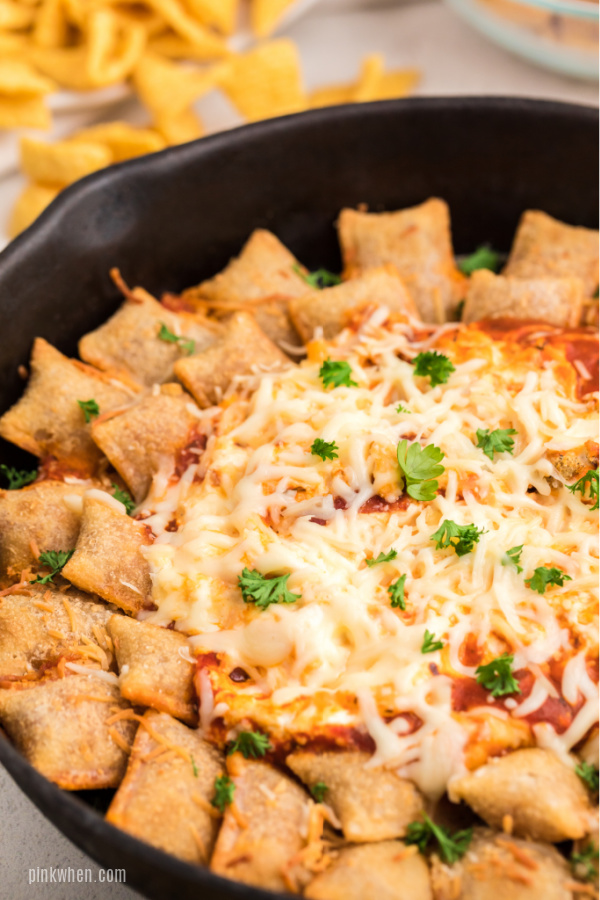 Pizza Dip and Pizza Rolls in a skillet and ready to serve.