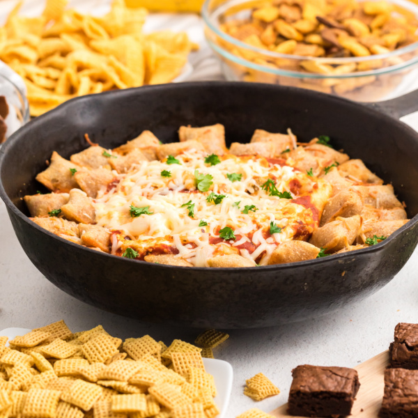 Skillet Pizza Rolls and Pizza Dip on a snack table ready to eat.