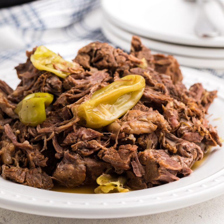 Instant Pot Mississippi Pot Roast on a white plate.