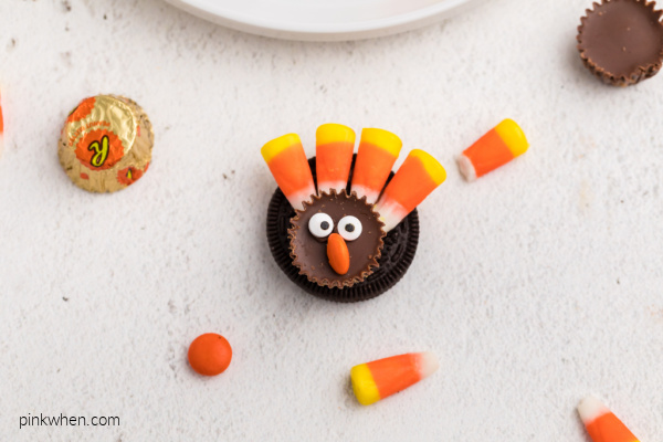 Turkey cookie made with candy corn, candy eyes, and Reese's pieces
