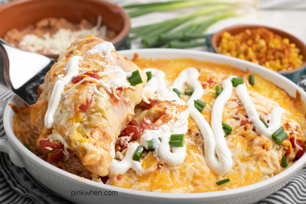 Chicken Taco Casserole being scooped from a white casserole dish.