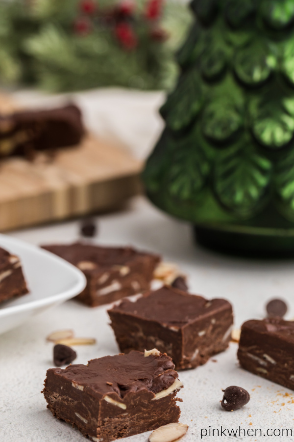Chocolate almond fudge scattered on a white table, 