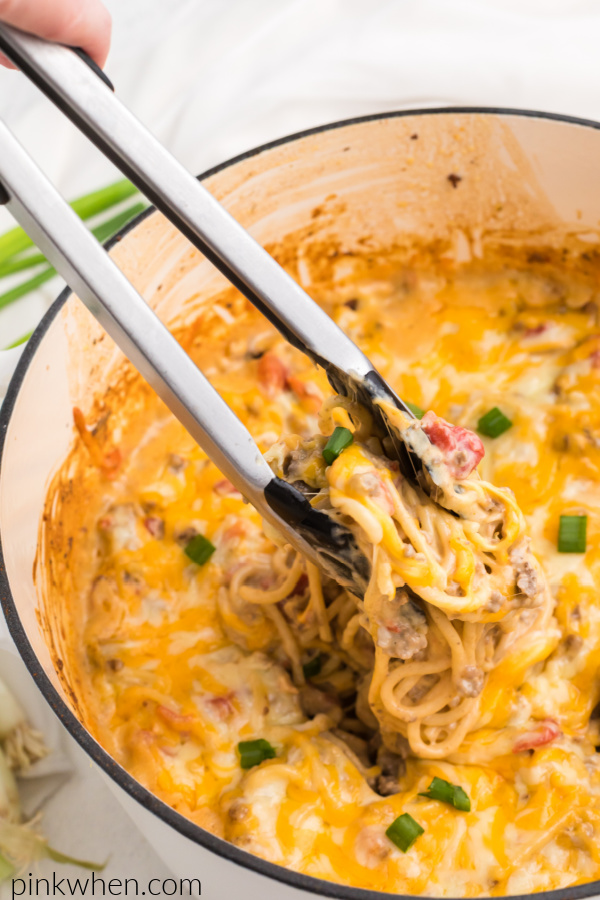 Cheesy Taco Spaghetti being scooped and ready to serve. 