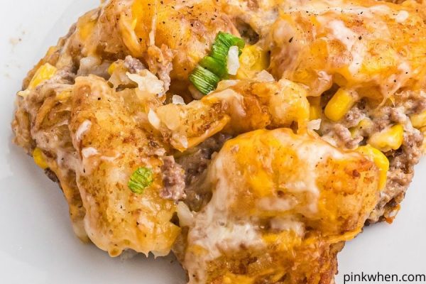 Tater Tot Casserole served on a white plate and ready to eat.