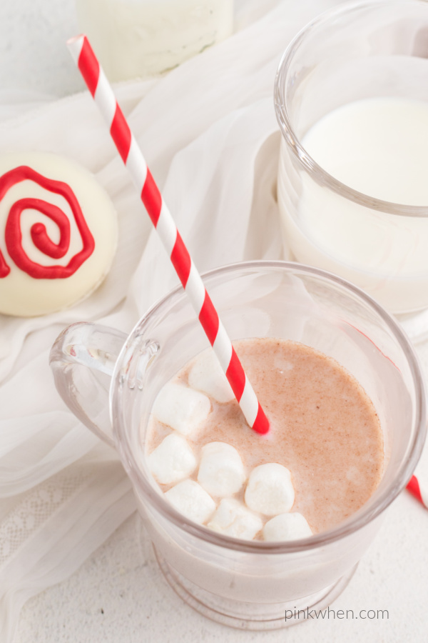 Hot chocolate bomb melted in a glass of hot milk. 