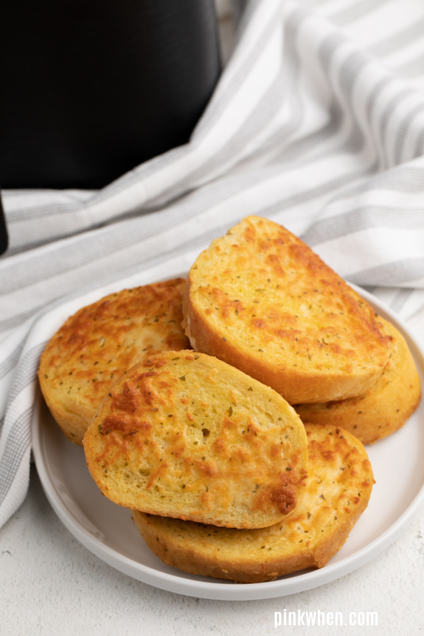 Air Fryer Texas Cheese Toast on a white plate ready to eat. 