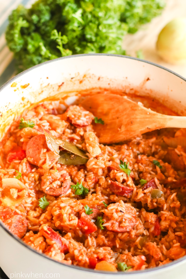 cooked Chicken Jambalaya in a large white dutch oven. 