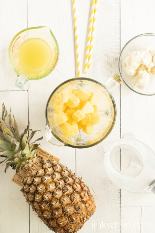 Ingredients needed for Pineapple Dole Whip: pineapple chunks, vanilla ice cream, and pineapple juice. 