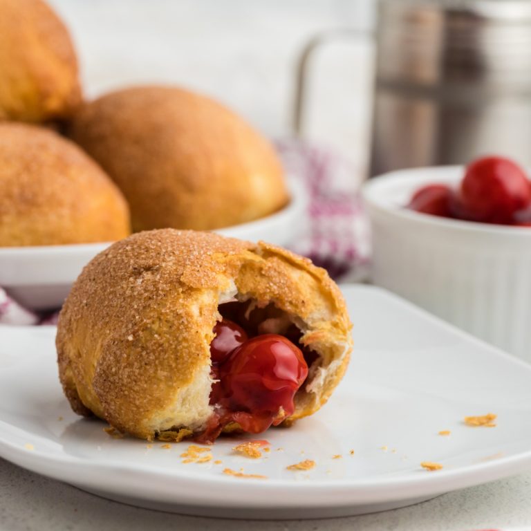 Cherry Pie Bomb on a white plate missing a bite.