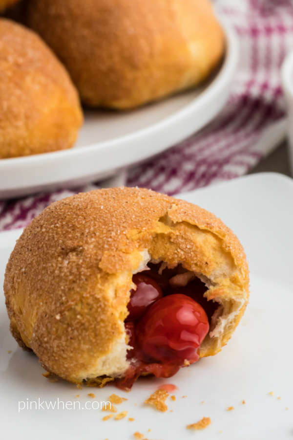 Cherry Pie Bomb missing a bite with a cherry peeking out. 