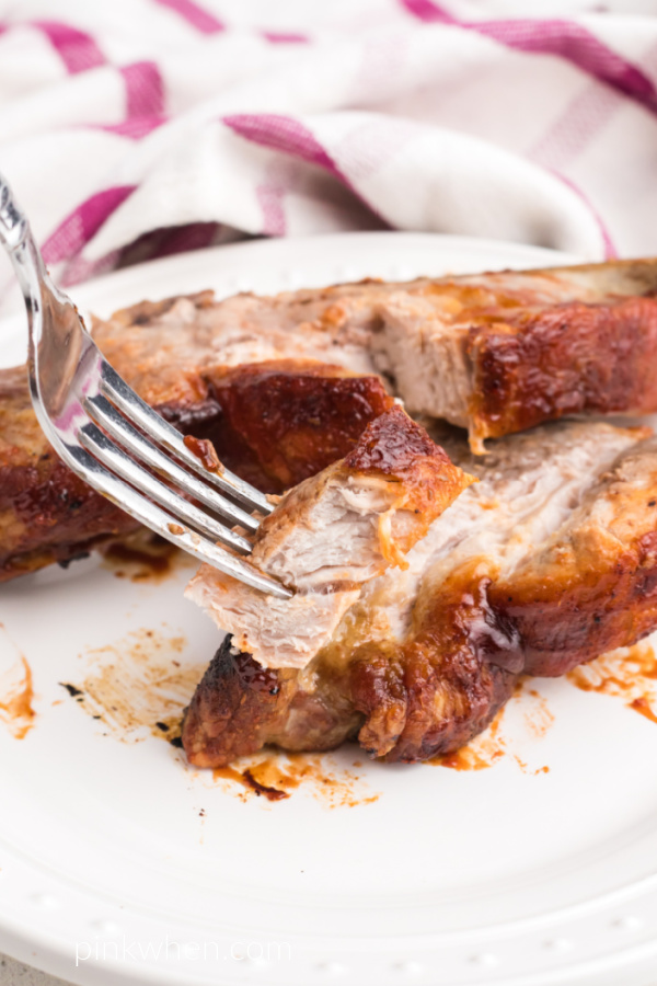 Air Fried country style ribs with a bite being removed and ready to eat with a fork. 